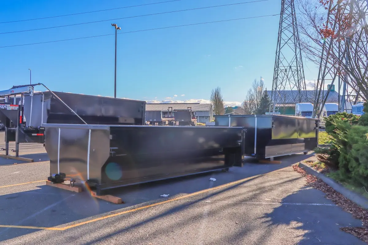 Roll-off dumpster ready for waste disposal at job site for Concrete Dumpster Rental in Destin